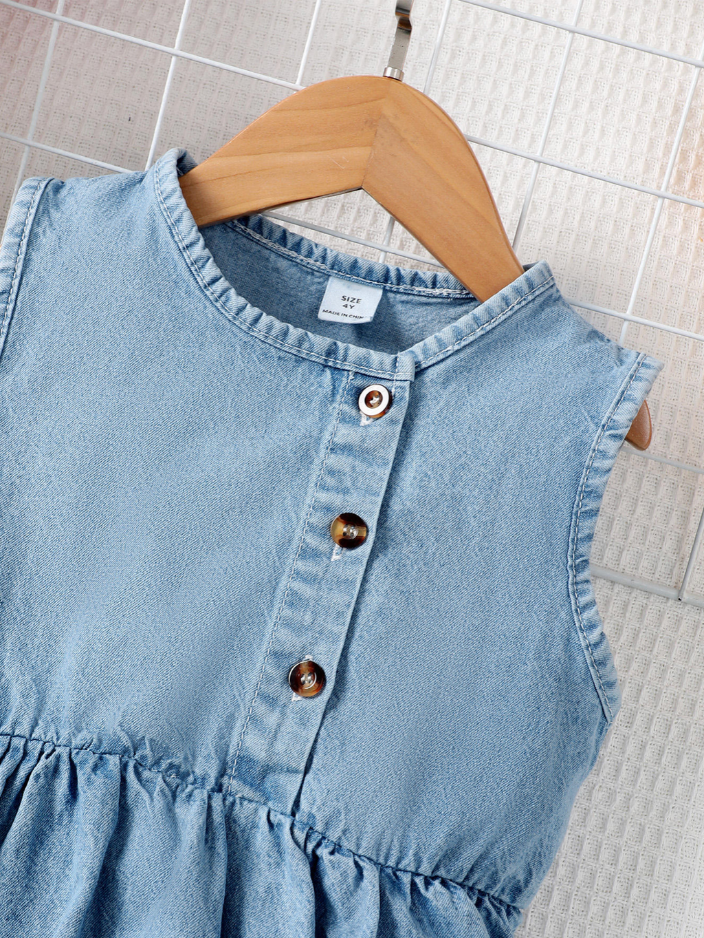 Adorable sleeveless denim dress for girls, complete with a matching ruffle purse!