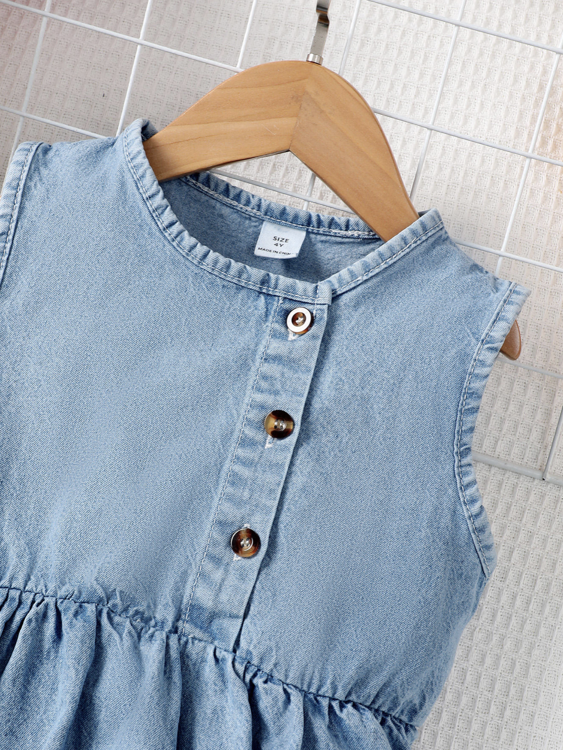 Adorable sleeveless denim dress for girls, complete with a matching ruffle purse!